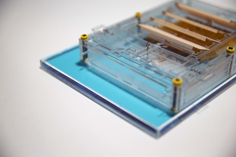 The evaporation engine sits on a shallow pool of blue water.