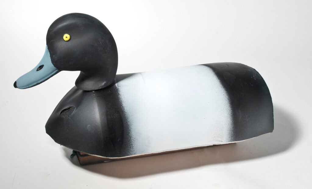 a duck decoy made out of a lobster buoy