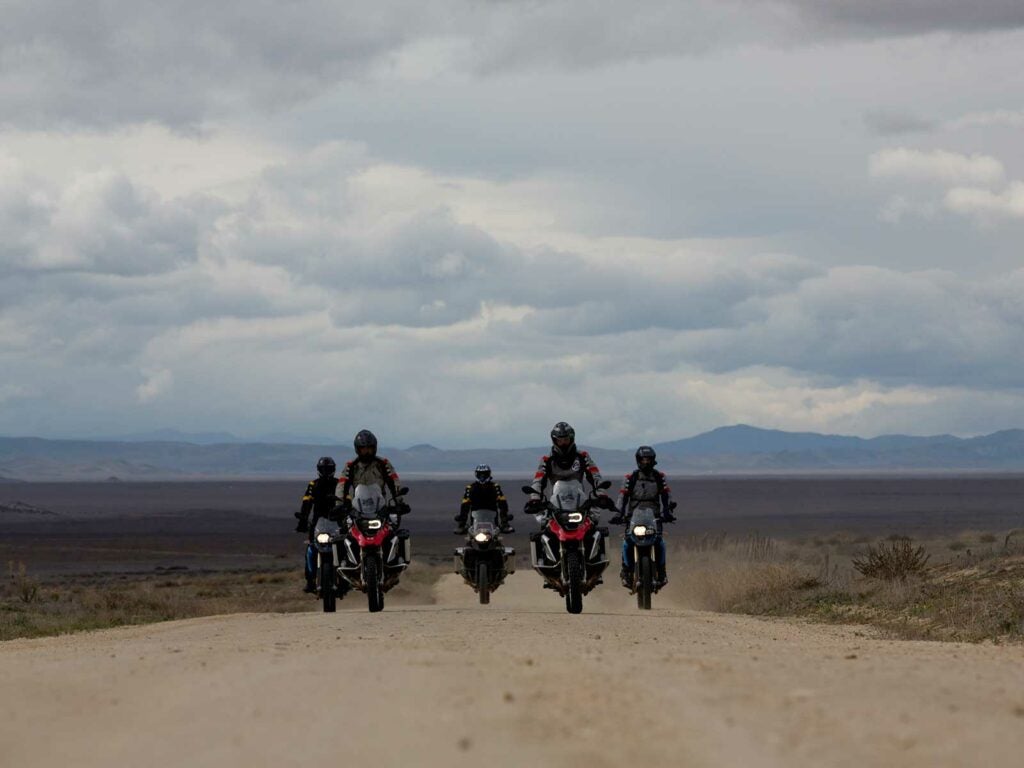 group of motorcycles on dirt road