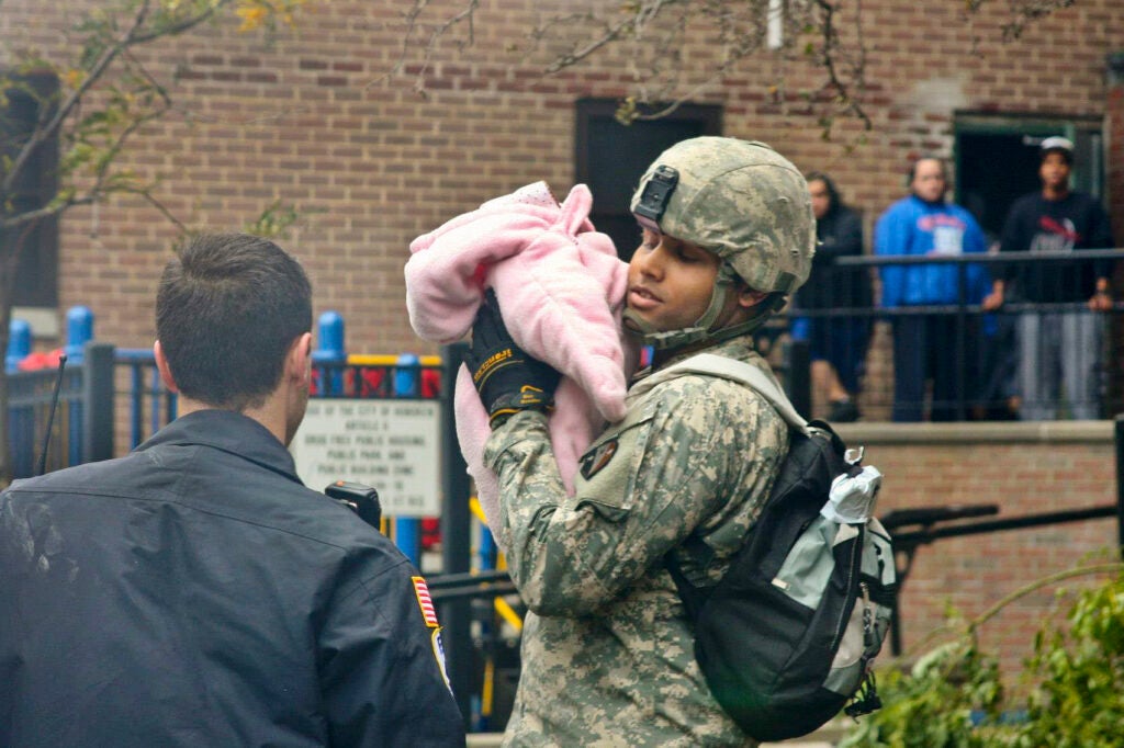 A National Guard soldier holds a baby displaced by Hurricane Sandy in Hoboken, NJ, October 31, 2012.