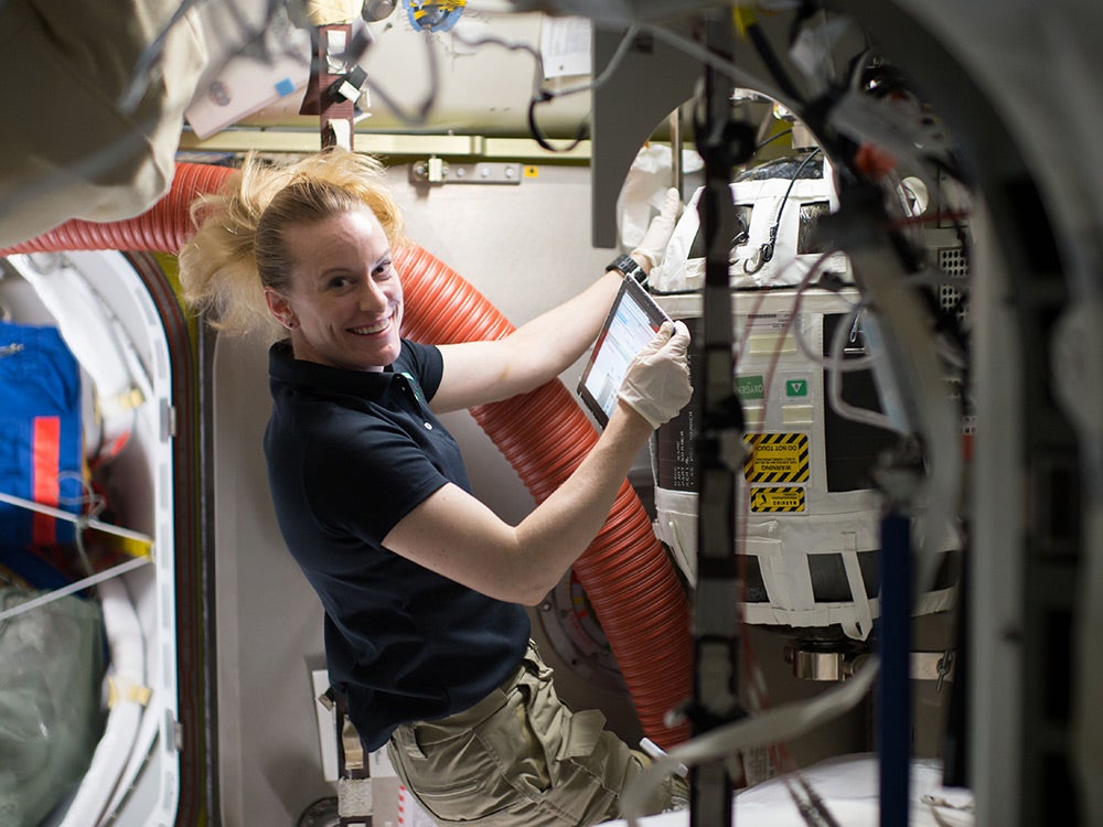 NASA astronaut refilling air supply