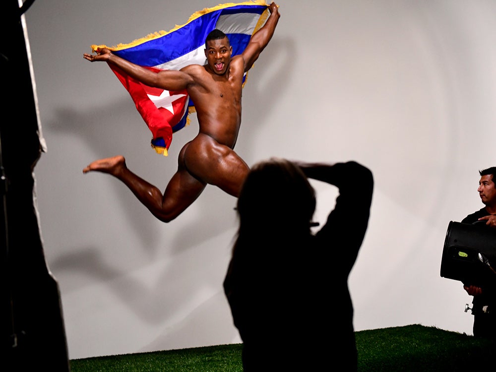 naked athlete jumping with country's flag