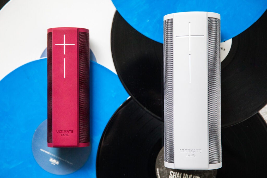 Two Ultimate Ears bluetooth speakers in red and white