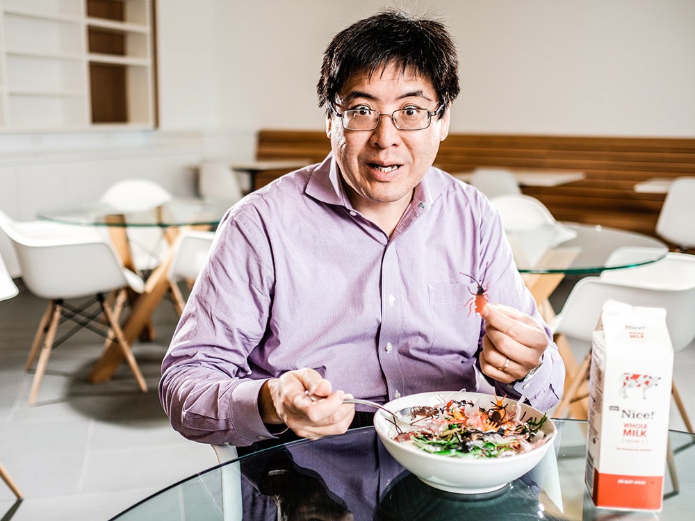 Sam Wang with bowl full of insects