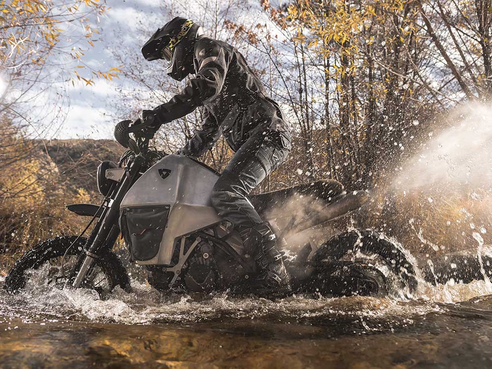 crossing a stream on a motorcycle