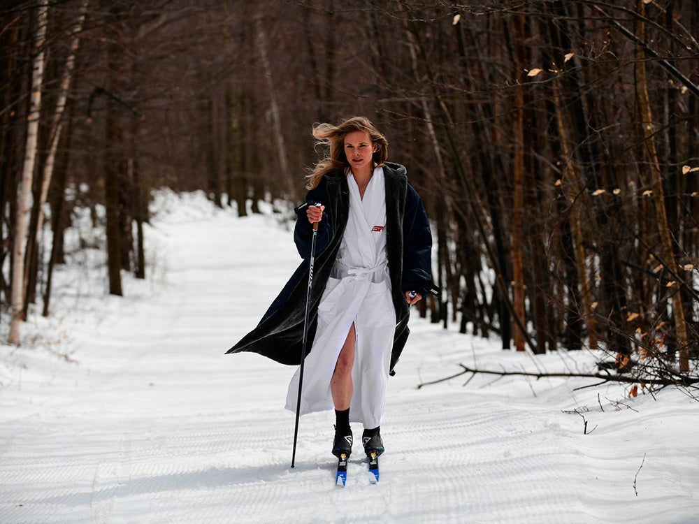 athlete in robe skiing through snow