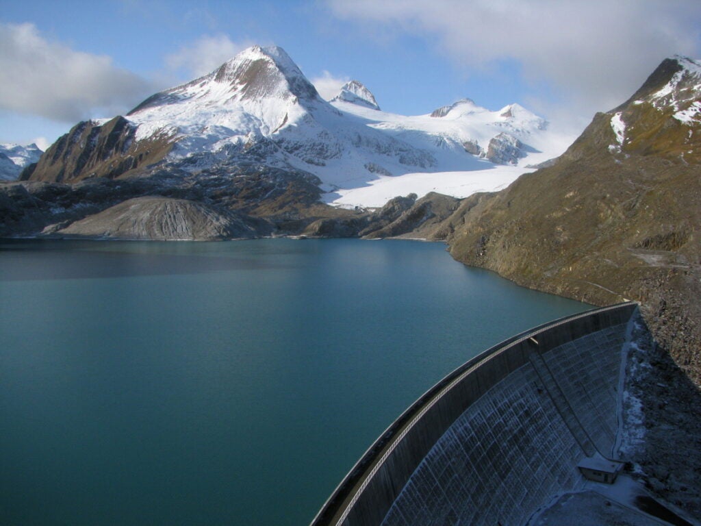 A dam collects water supplied by the Gries glacier.