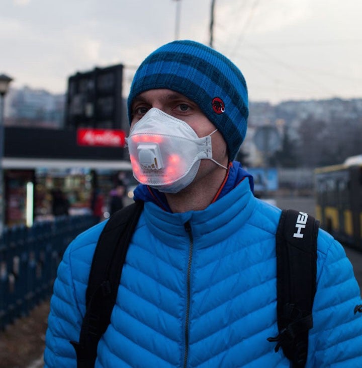 Man wears Airbeam LED mask
