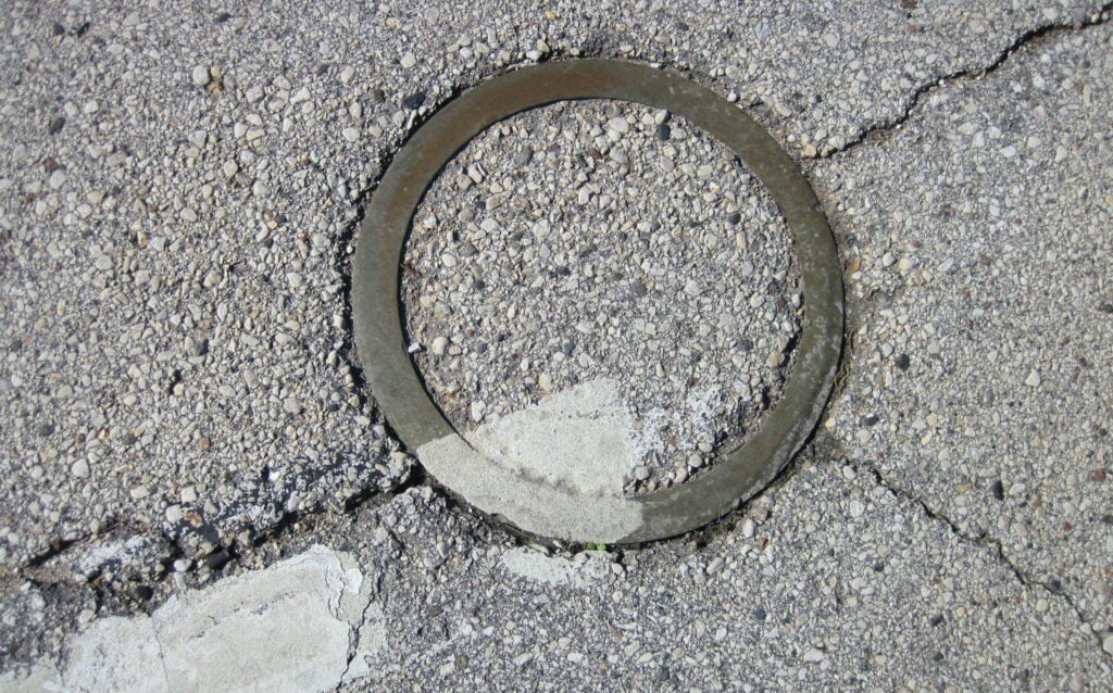 The brass ring marking where debris landed