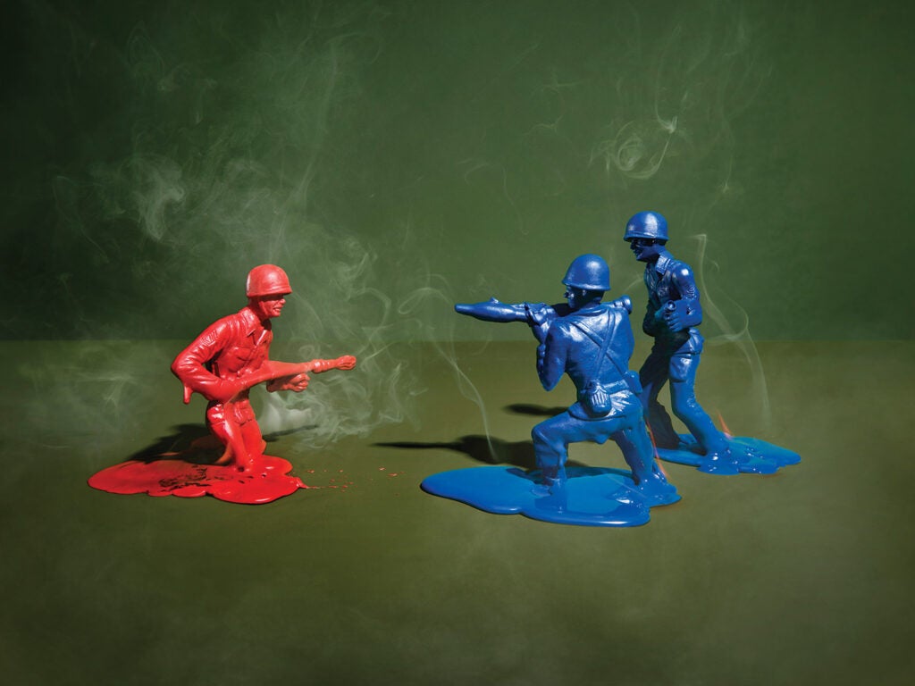 two blue and one red army man melting into floor