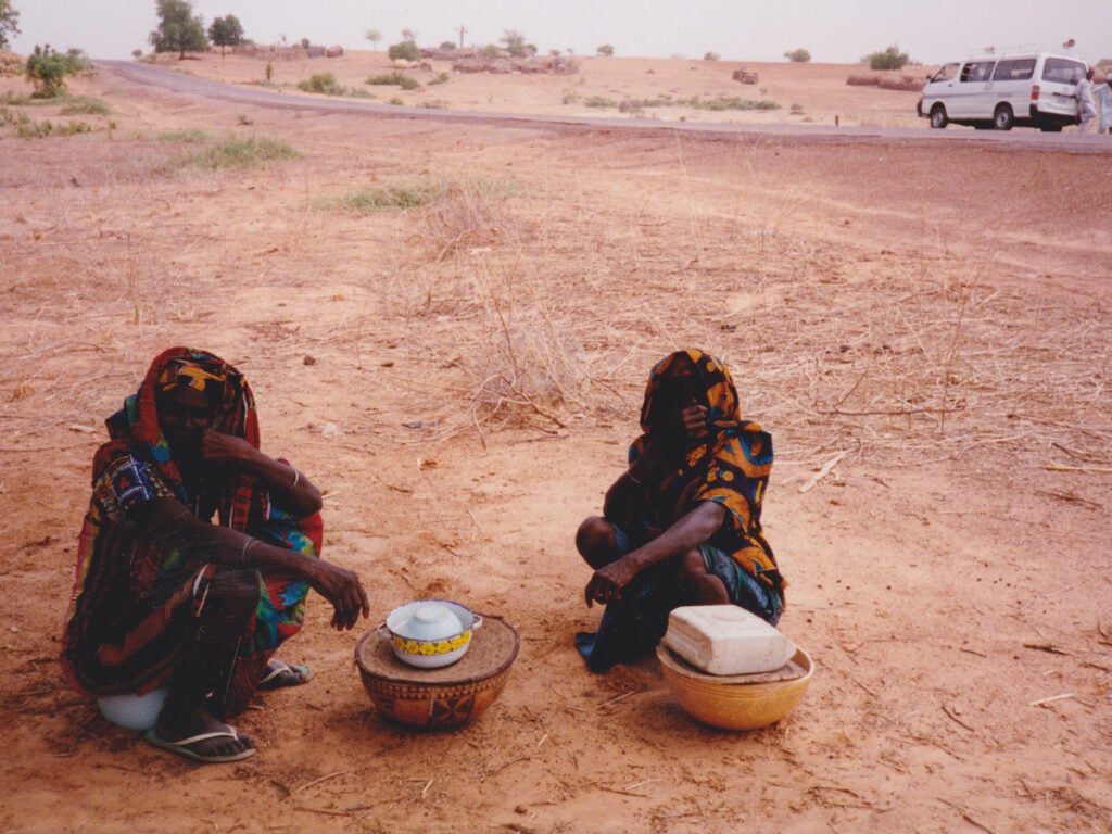Two women sell roadside refreshments in rural Kano