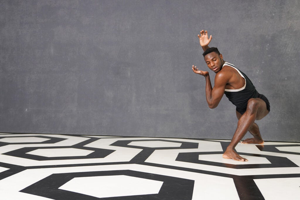 dancer on black and white geometrical floor