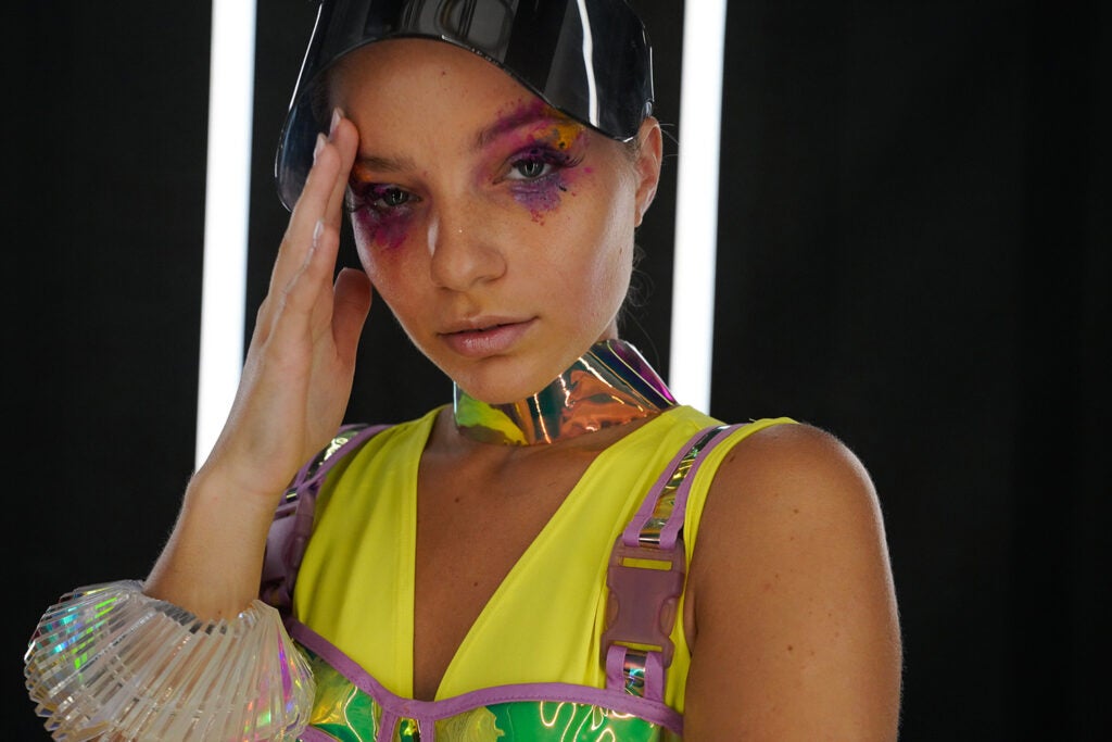 woman in colorful clothing and makeup