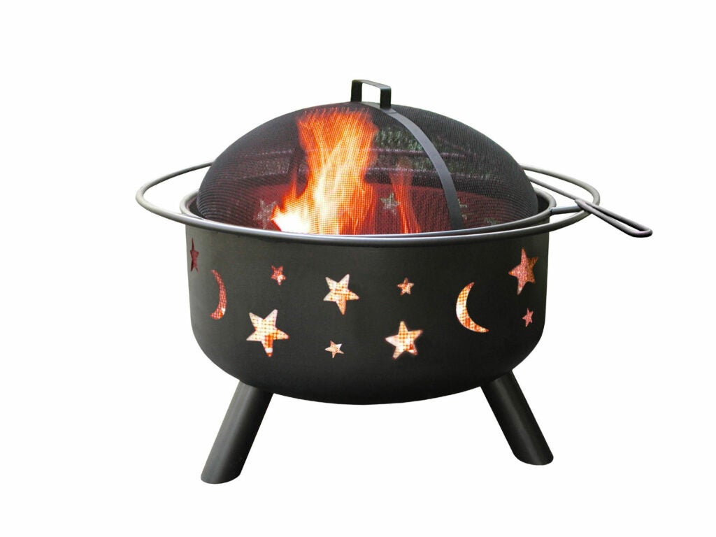 Fire pit with moon and star cutouts