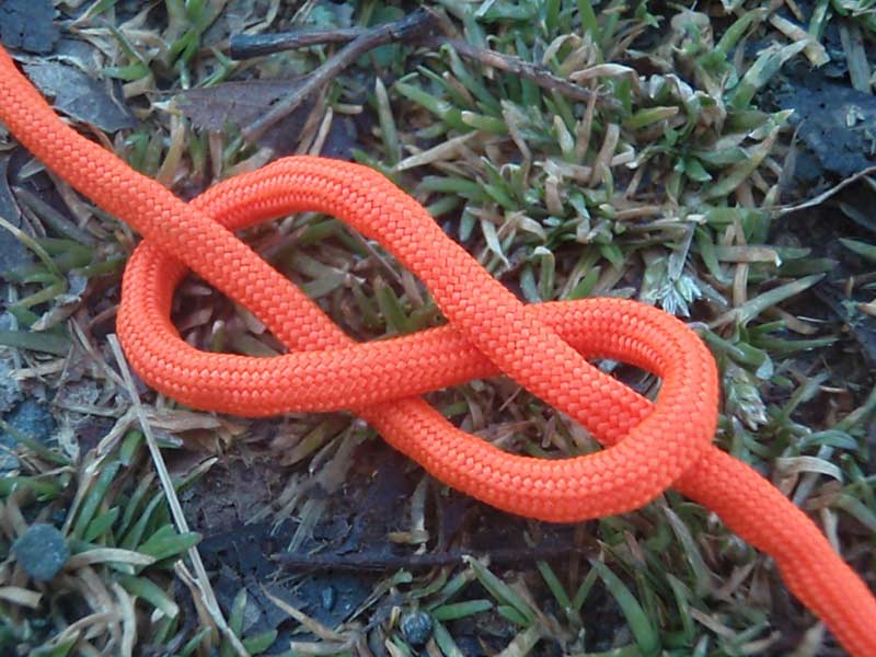 a figure 8 knot with orange paracord