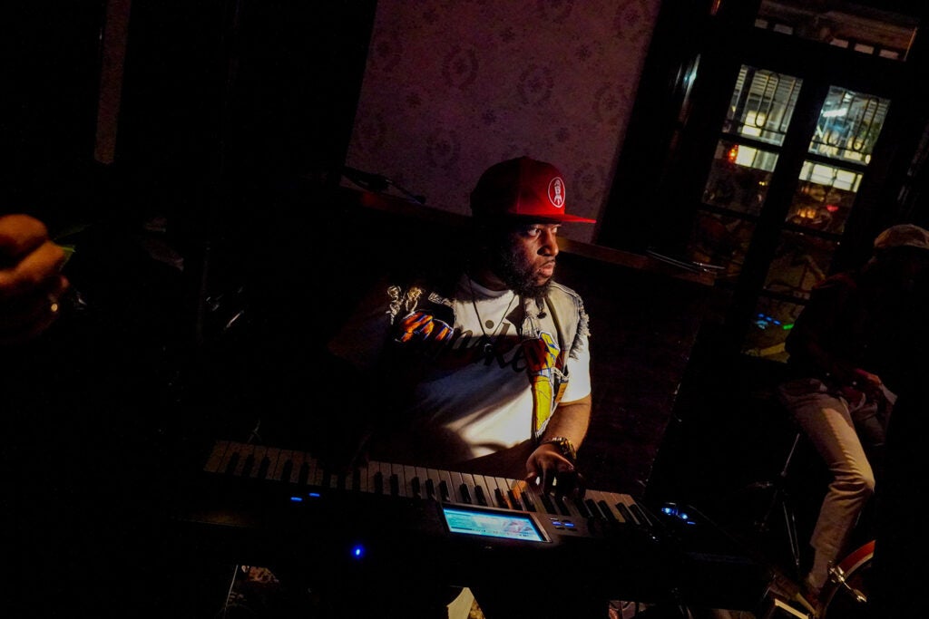 playing the keyboard in a red hat