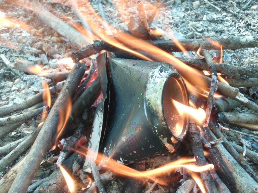 Burn up the can to make char cloth for flint and steel.