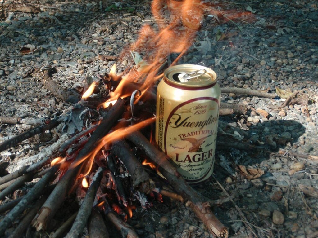 Use a beer can as a pot to boil water.