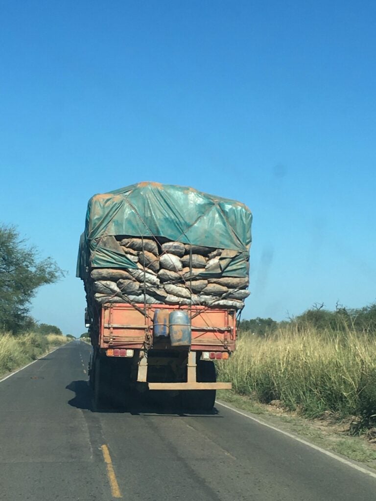 Bags of charcoal stacked on a truck