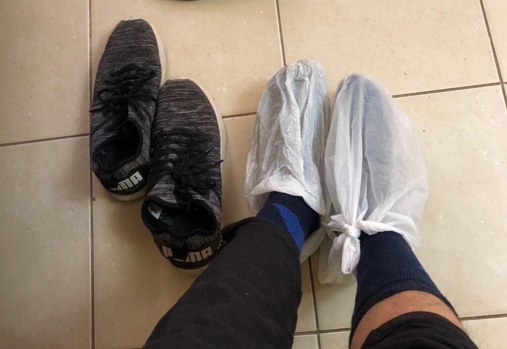 feet with plastic bags