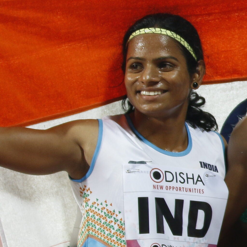 dutee chand celebrating a bronze medal in the 4x100 meter relay