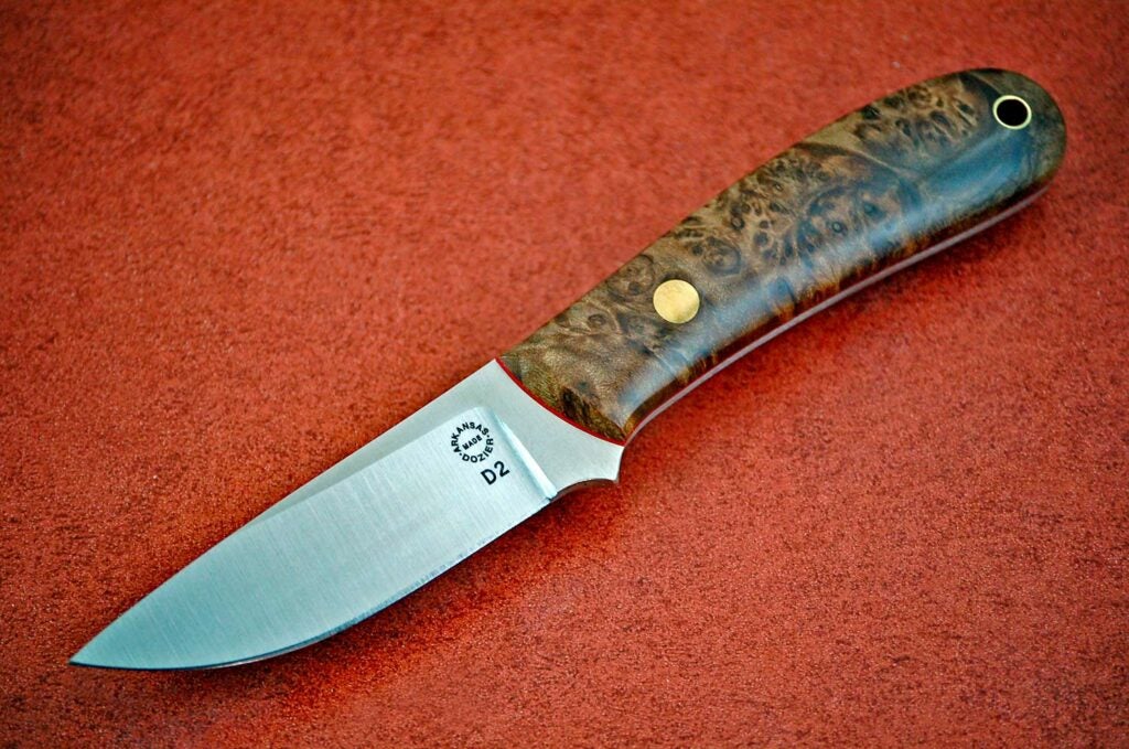 Dozier Knives is well known for the use of D2 steel like their Yukon Pro Skinner.