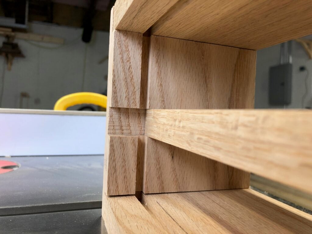 the rabbet and dado joints holding the oak key cabinet shelf organizer together