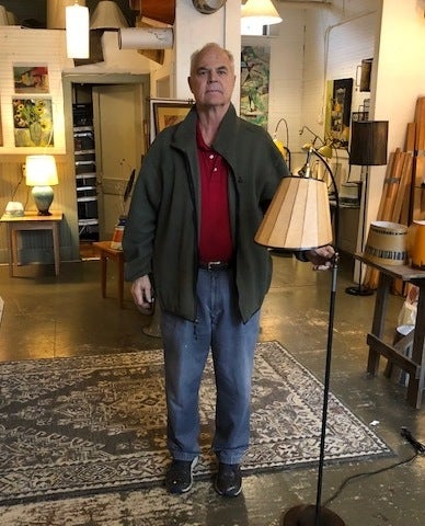 Ken Blaisdell, owner of Lampscapes, in White River Junction, Vermont, with his Brakelight lamp, which is made with a brake rotor as its base