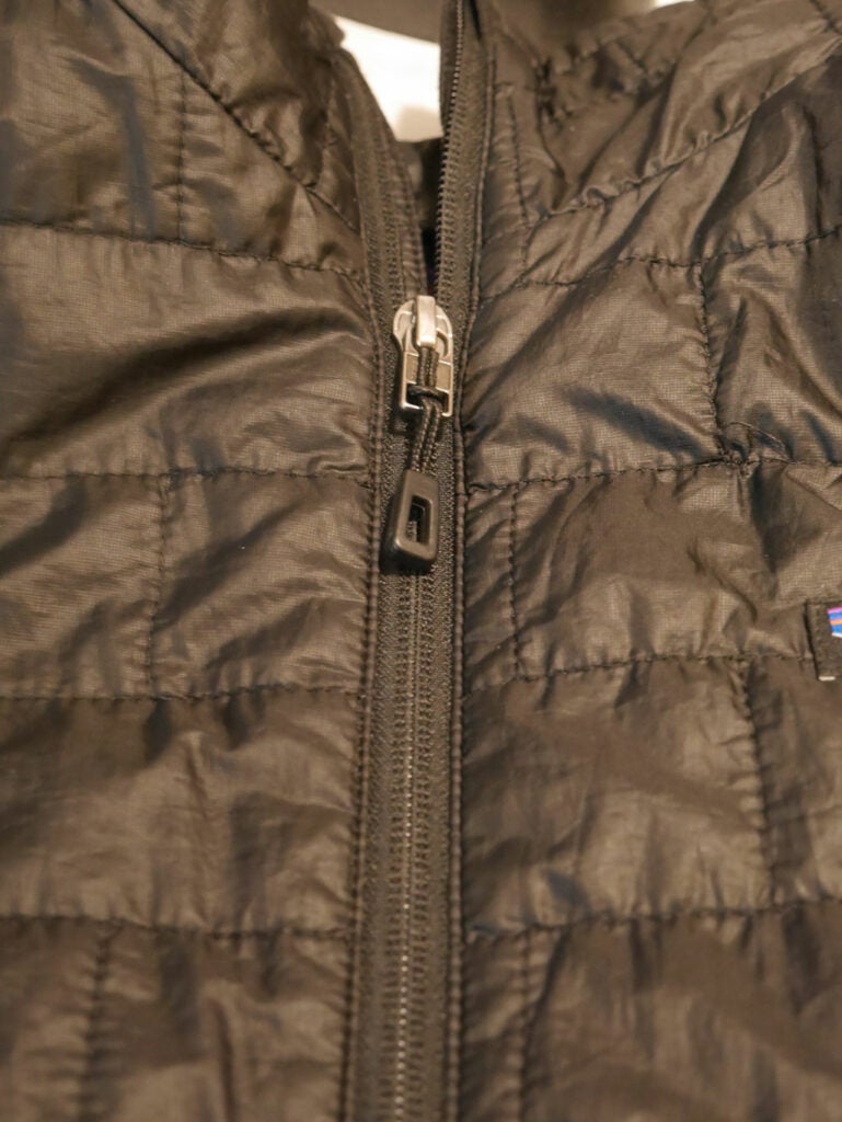 a brown winter jacket with a zipper that needs to be lined up for proper replacement