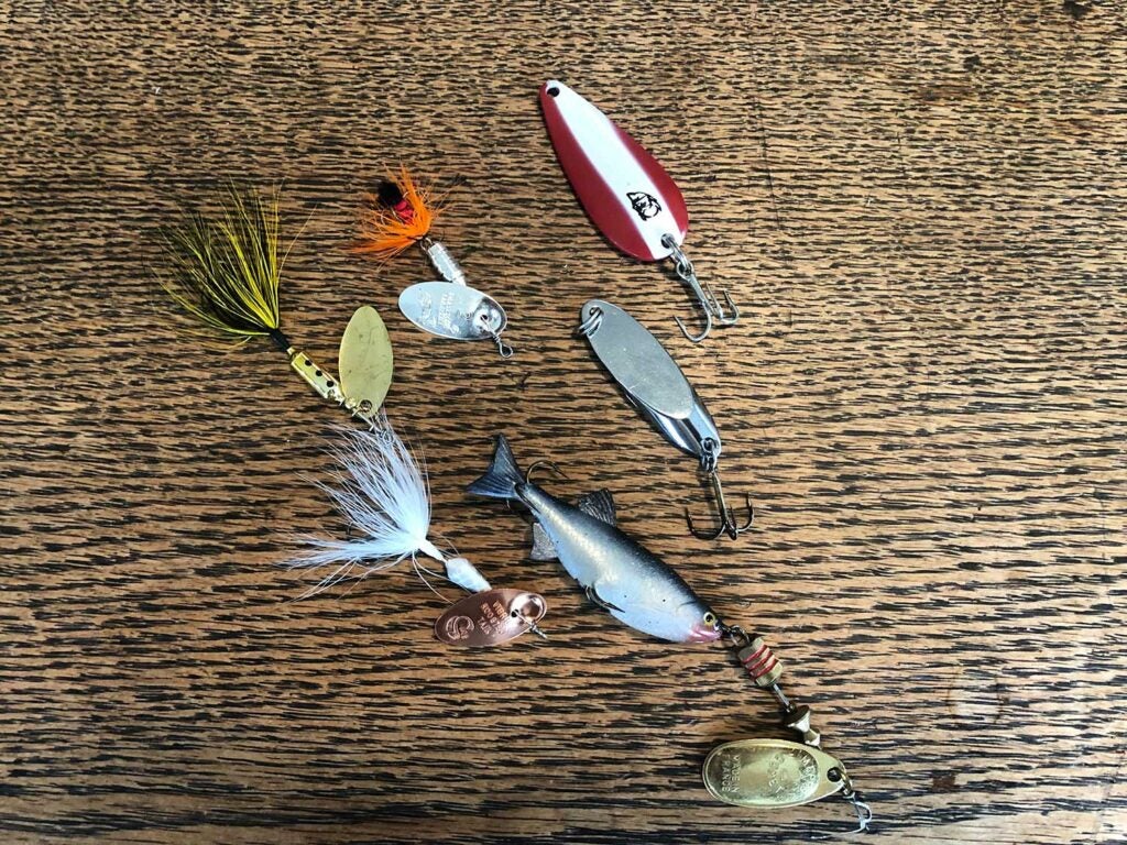 Assorted trout spinners and spoons.