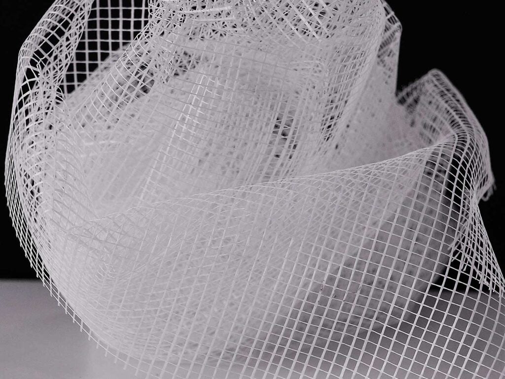 A mosquito net on a black background.