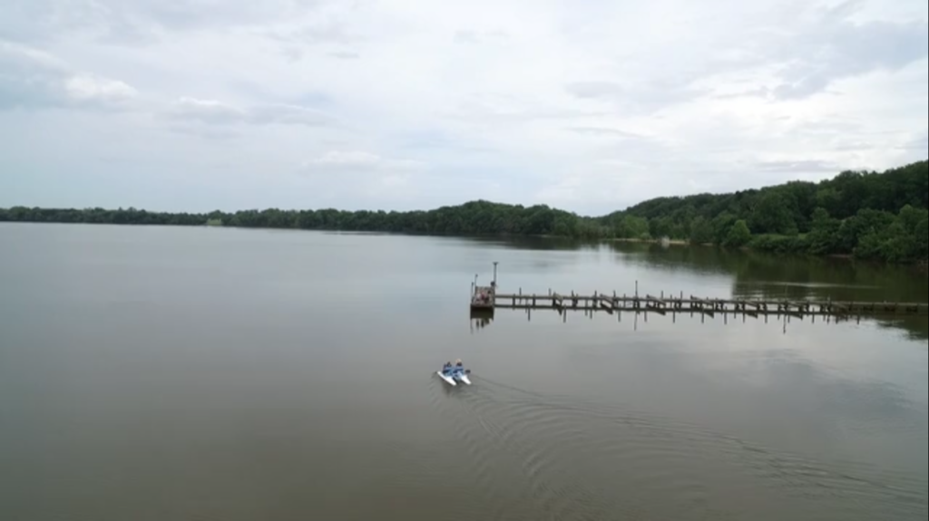 A drone view of Riti and his wife on the boat