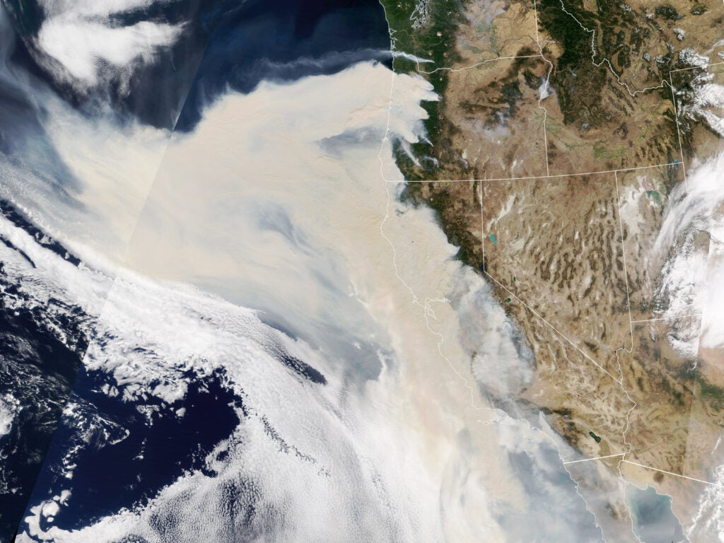 The smoke was so thick and widespread that it was easily visible from 1.5 million kilometers (1 million miles) away from Earth. When NASA’s Earth Polychromatic Imaging Camera (EPIC) on NOAA’s DSCOVR satellite acquired the image below, large areas of Oregon, California, and the northeastern Pacific Ocean were obscured by smoke.