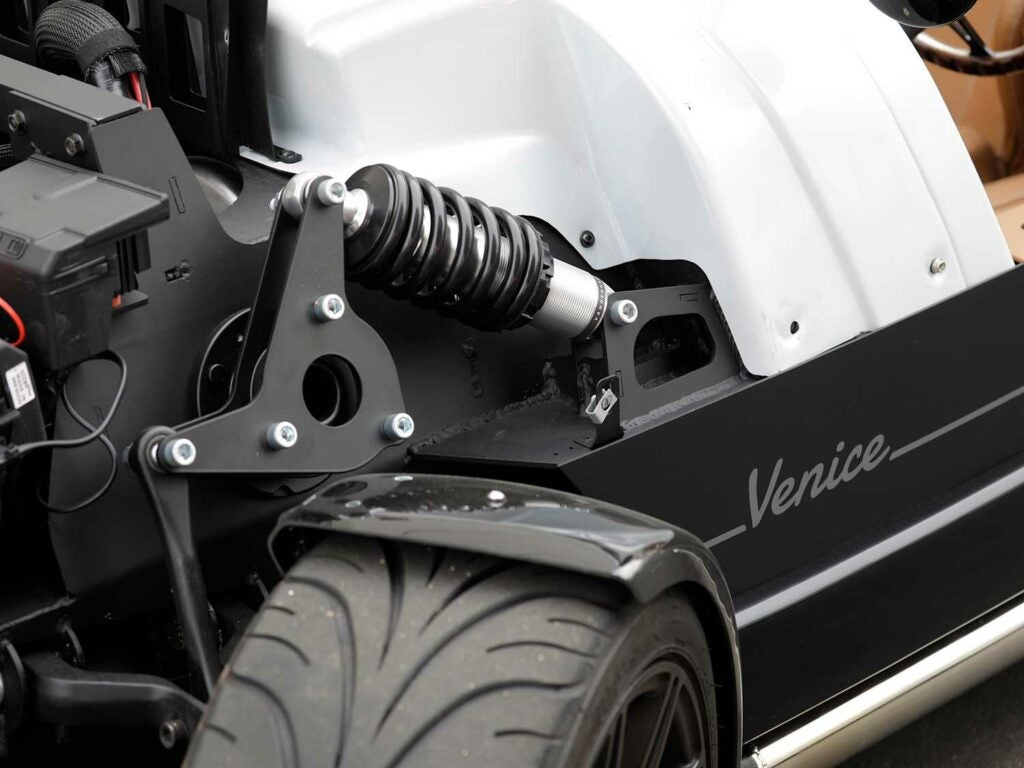 F1-style pushrod suspension makes for a shorter hood line versus a typical MacPherson setup.