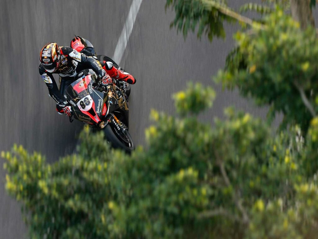 Peter Hickman (BMW Bathams Racing) photographed from the roof of a house on the streets turned racetrack in Macau.