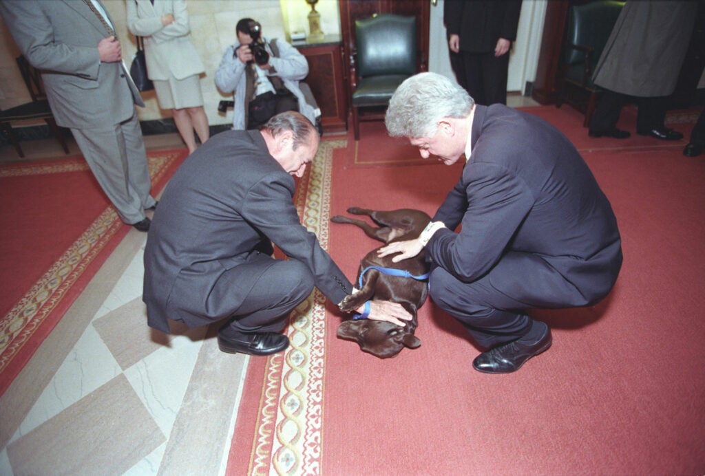 President Clinton and President Chirac of France showing Buddy some love in 1999