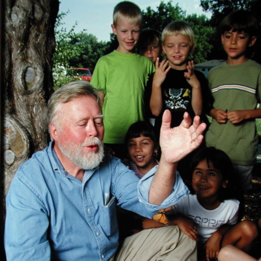 Entomologist Chip Taylor demonstrates tagging and release of a butterfly at a school